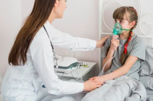 A healthcare professional helps a child use an inhaler as part of asthma evaluation and treatment