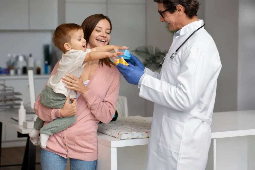 A doctor examines a child holding a toy in a welcoming, child-friendly environment, while the child's mother highlights the importance of the pediatric clinic.