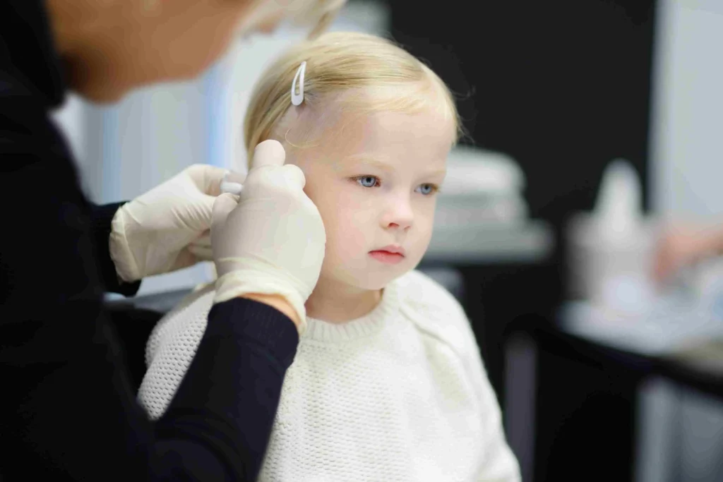 A little girl prepares to perform ear Piercing, with sterile tools and a calming environment in the background. 