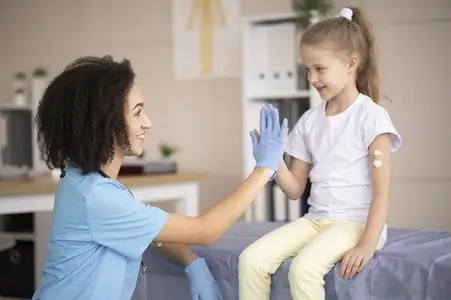 A healthcare professional during a sports physical examination of a young girl