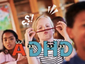 A girl playfully holding a pencil in her mouth with a funny expression, while other students are visible in the background. The word 'ADHD' is displayed with eyes and playful graphics.